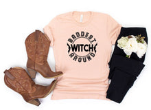 Load image into Gallery viewer, Baddest Witch Around Halloween Graphic Tee | Multiple Colors - Elevated Boutique CO
