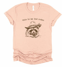 Load image into Gallery viewer, This is my 2nd Rodeo Cowboy Racoon Graphic Tee | Multiple Colors - Elevated Boutique CO
